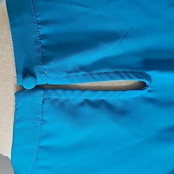 Elle Turquoise Sleeveless Blouse with Ruffles and Pleated Front - Picture 3 of 15